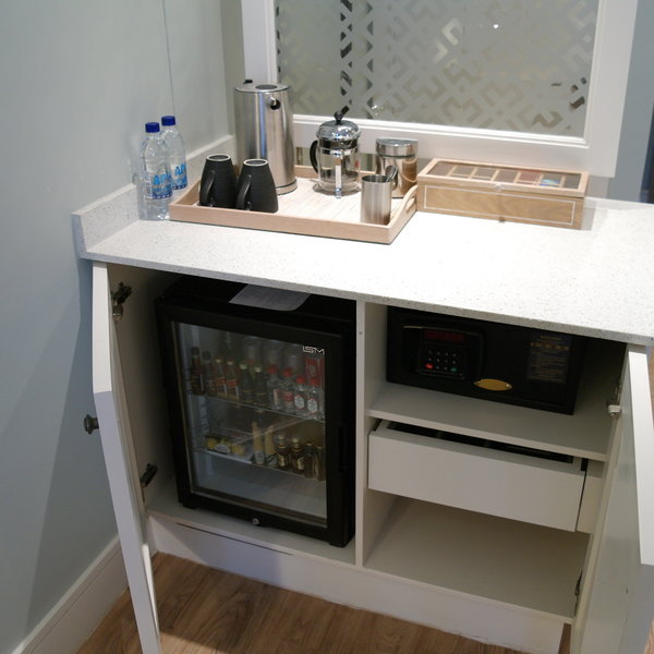 There is also a mini fridge and a tea & coffee station.
