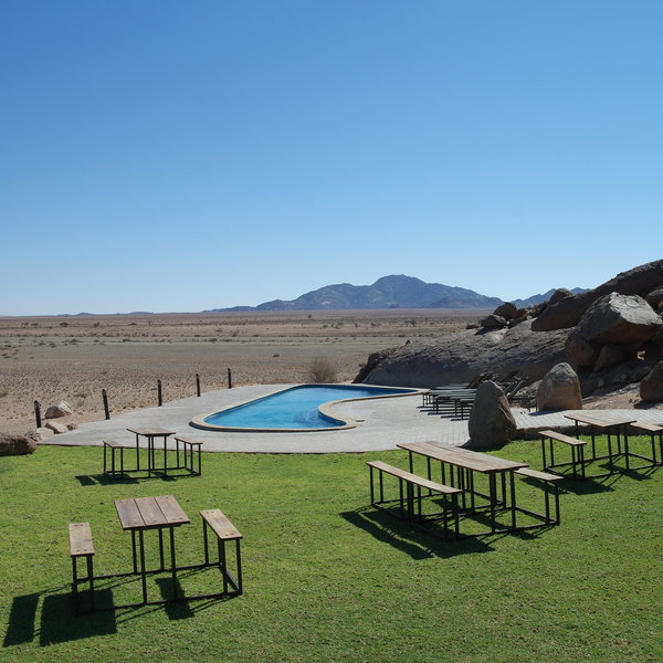 …with a large swimming pool and several seating options…
