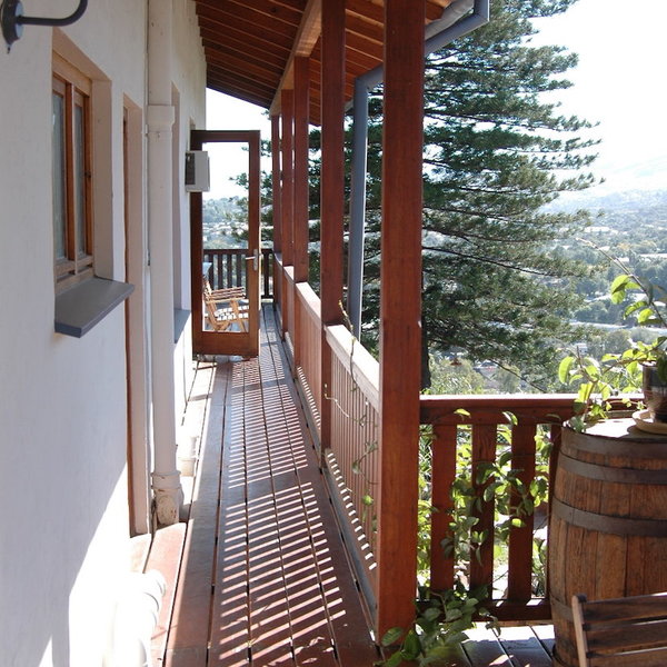 Outside is a balcony which wraps around the side of the house...