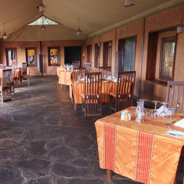 The dining room contains individual tables and…