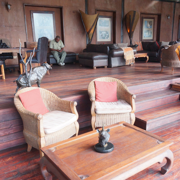 The lounge area is furnished with rustic sofas and it has a great view.