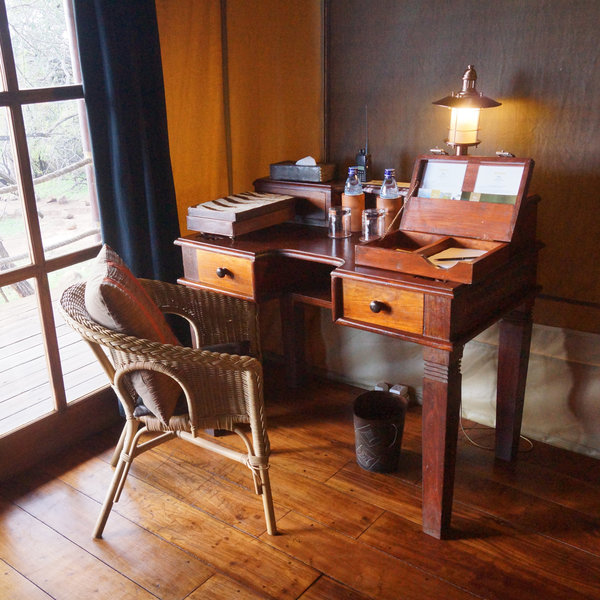 Each includes a writing table, a small sitting area, a wardrobe and…