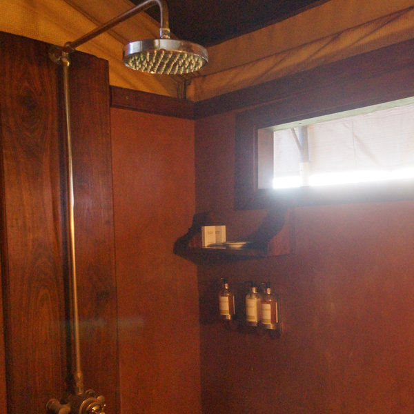 … a flushing toilet and a shower with hot water.