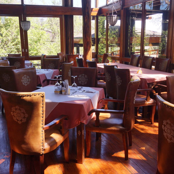 The meals are served in the dining room with individual tables.