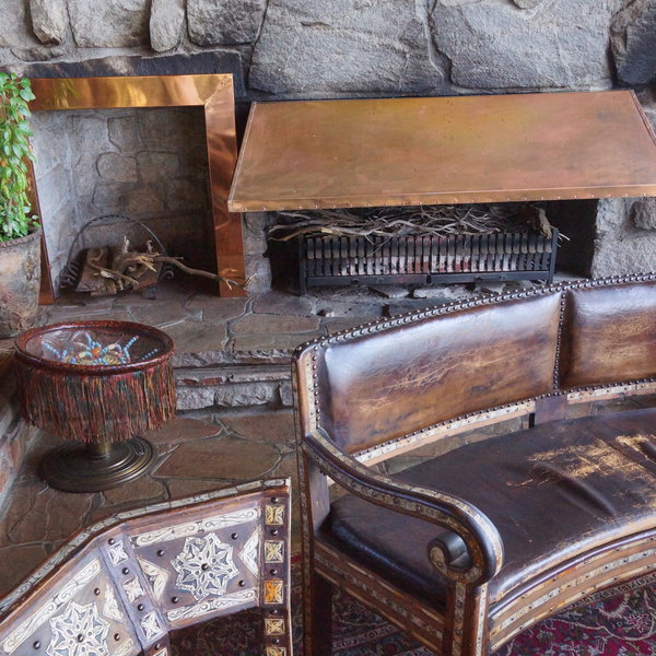 Above the dining room, there is also a comfortable lounge area with a fire place…