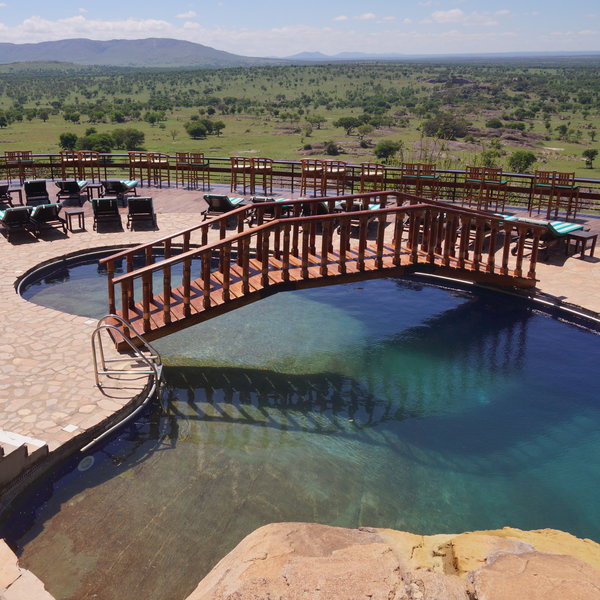 The large swimming pool is surrounded by sunloungers…