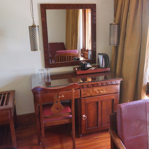 There is a writing desk with tea and coffee making facilities,…
