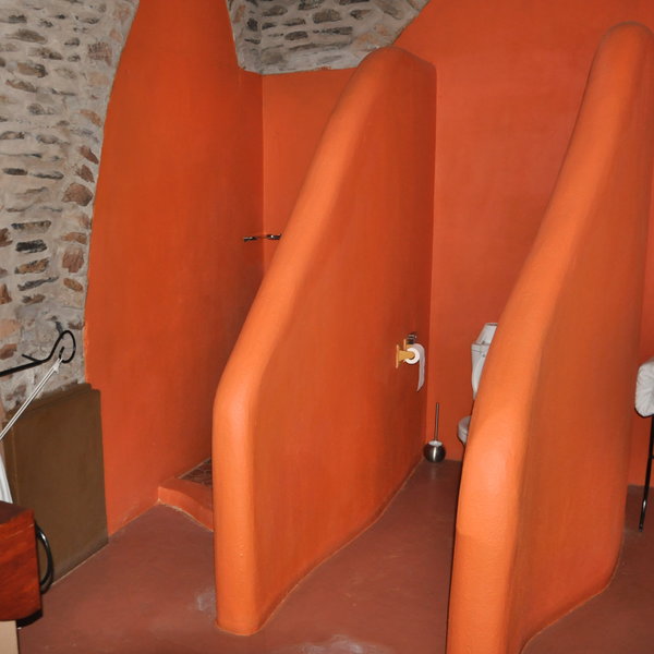 The en-suite bathrooms has his and hers sinks and a shower and a toilet.