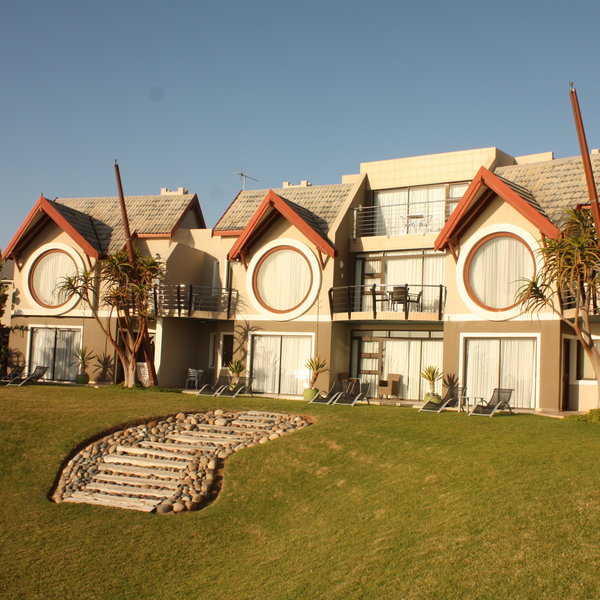 and the downstairs rooms have a private patio leading straight onto the lawn.