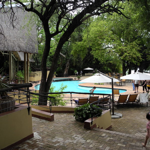 …around the large swimming pool,…