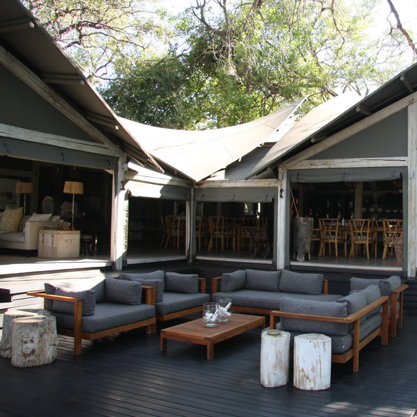 The outside areas include a small, open-air lounge with several comfy sofas and chairs,...