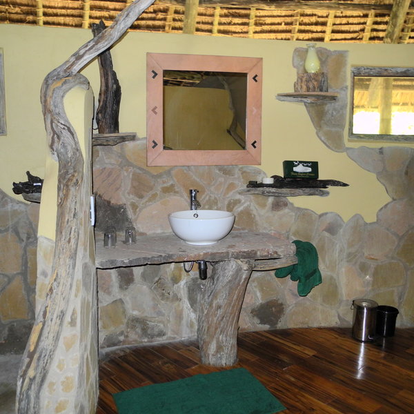 ...bathrooms at the back of the tents with a flush toilet and a shower...