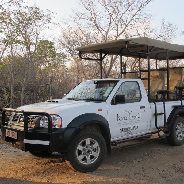 Activities are conducted in open-sided safari vehicles with three rows of seats.
