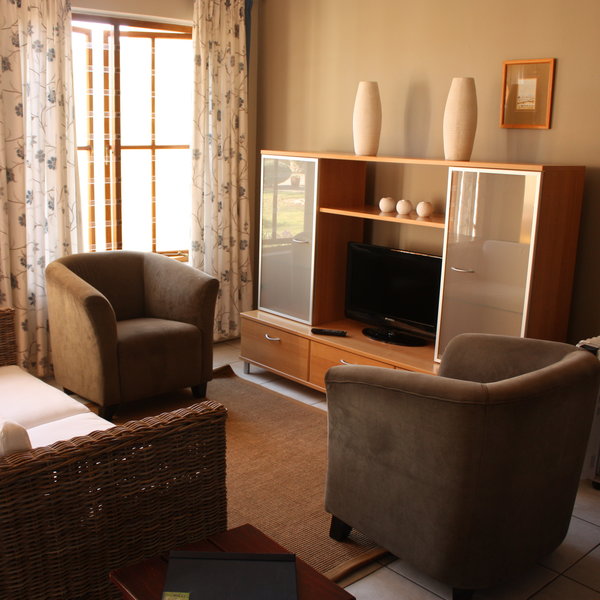 There is a cosy lounge with satellite TV...