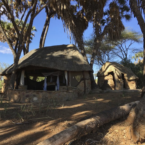 The larger of the two bandas is at the western end of the small camp, this has a separate shower and toilet ...