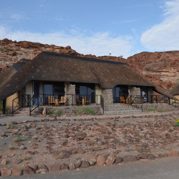 Each thatched unit has four twin rooms...