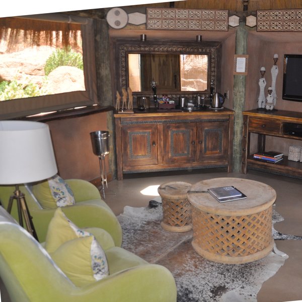 ...an adjoining lounge equipped with air-conditioning, satellite television, mini-bar…