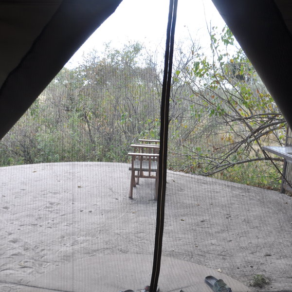 Outside of the tents is a small seating area...