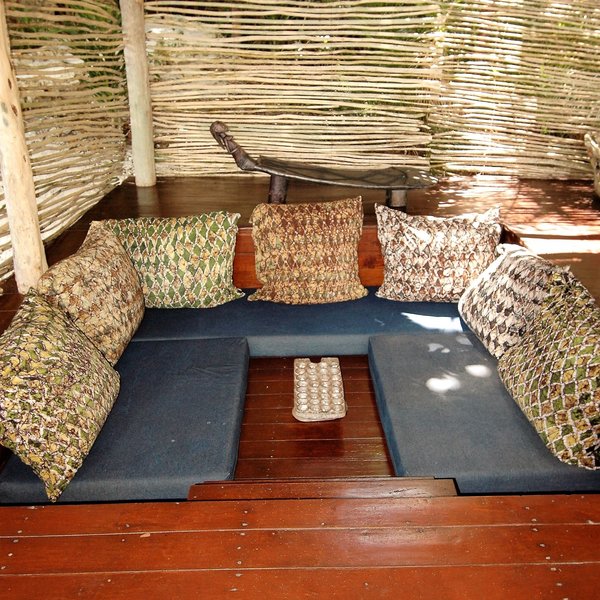 ... and also a sunken lounge, styled with Fundu Lagoon's trademark dark blue cushions.