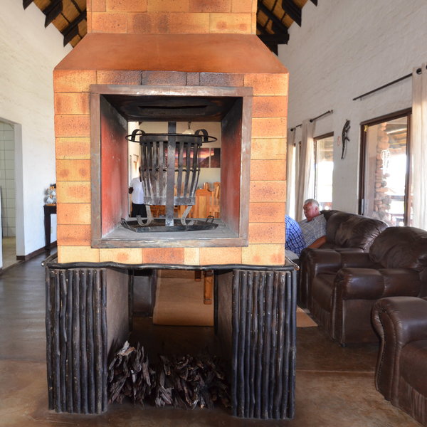 The lounge area has a large central fire and comfortable sofas where you can relax.