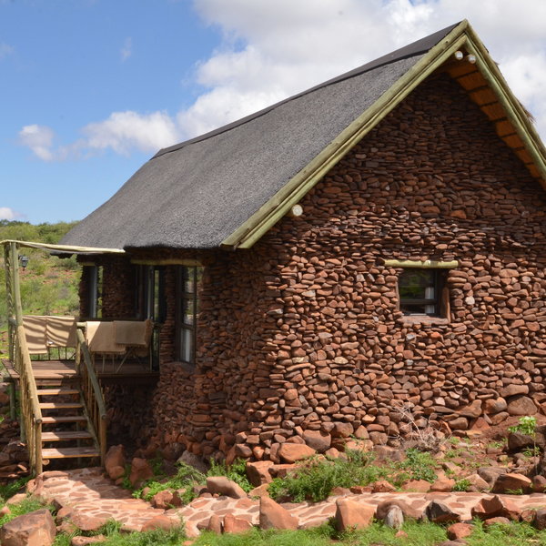 The individual stone and thatch chalets...