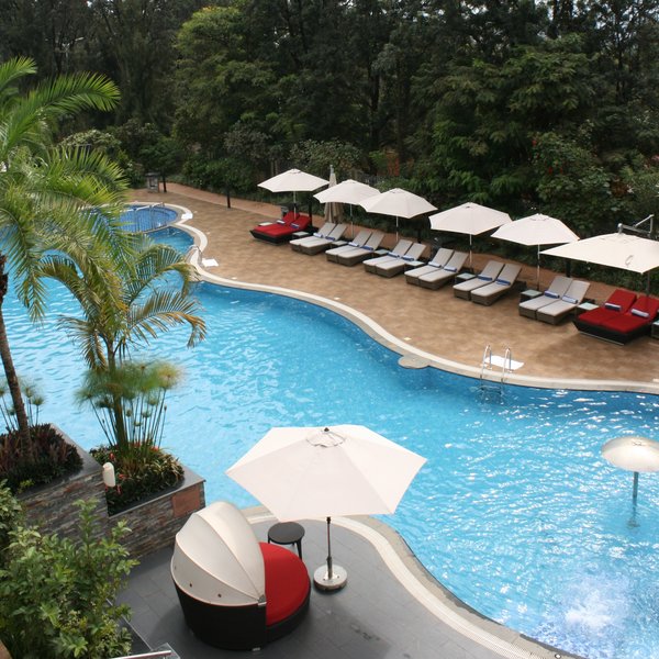 Outside you can find a lovely pool surrounded by shaded loungers and tropical gardens.