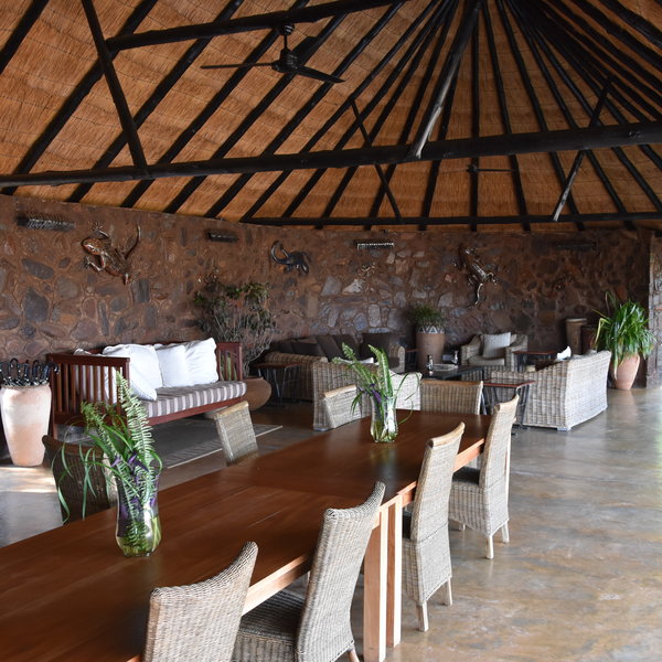 The main area is a large open fronted thatched building...