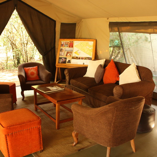 …simply furnished with easy chairs and sofas…