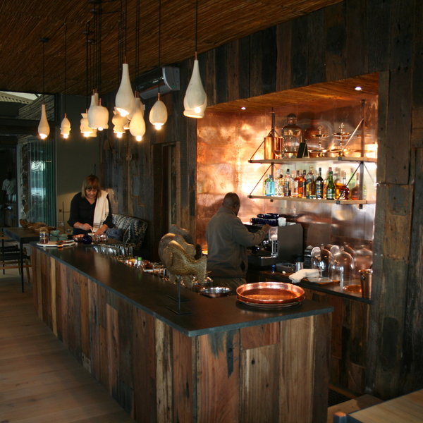 …where you’ll find a well-stocked bar, as well as wine cellar and spacious lounge area.