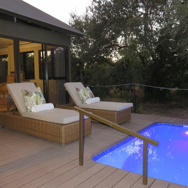 Comfortable sun loungers sit on the private terrace...