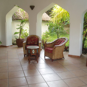 …With terracotta tiles and white washed walls, mixed with Tanzanian furniture.