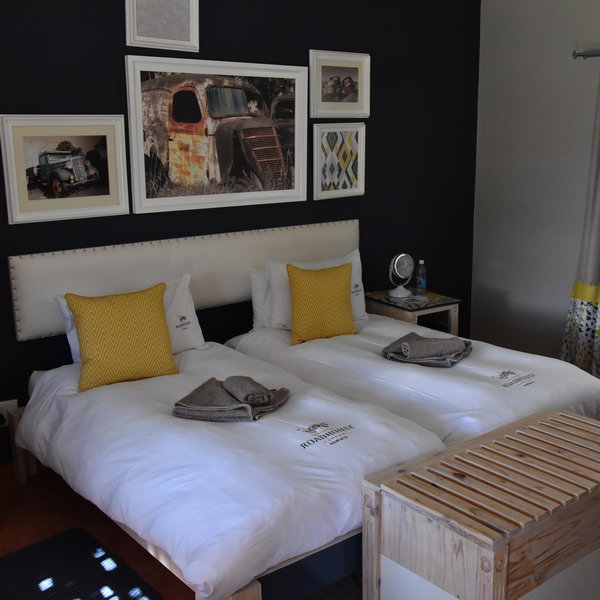 Inside the rooms are near identical with comfortable twin beds...