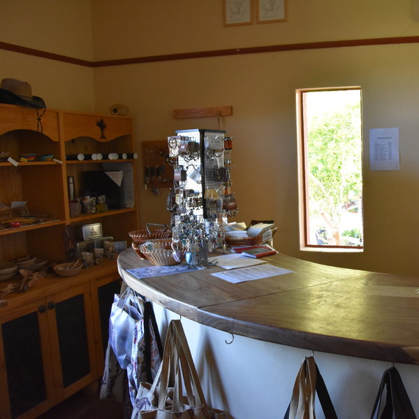 The main area consists of a reception/curio shop...