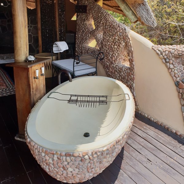 Each cottage has an open air bathtub...