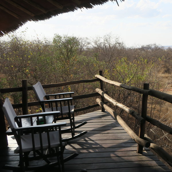 Outside each room is a wooden balcony with beautiful views over the park.