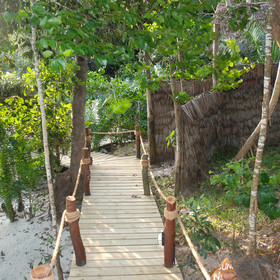 All the rooms are discretely tucked away into the lush tropical greenery...