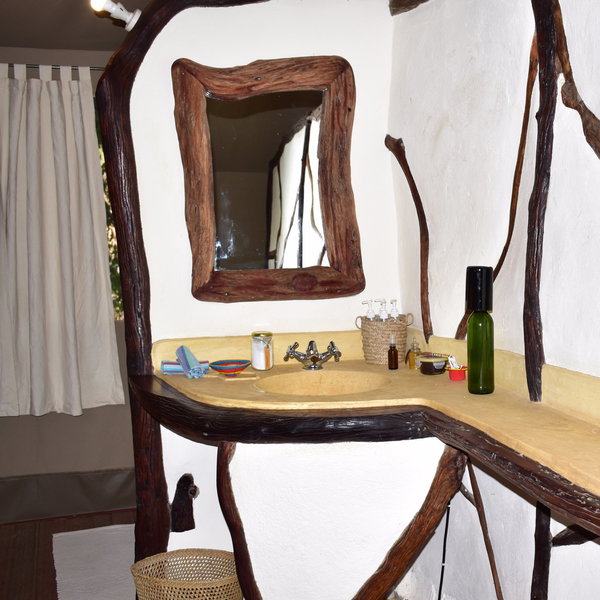 The en-suite bathroom has a single basin...