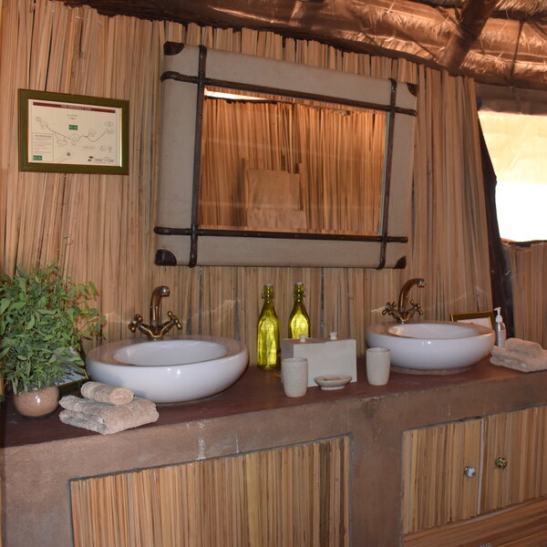 The bathroom has twin basins…