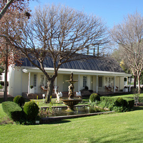 The homestead has 14 rooms, all surrounded by a neat rose garden.