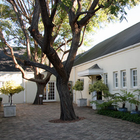 ...is a mid 19th-century homestead on the outskirts of Oudtshoorn...
