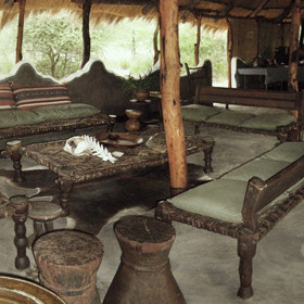 with a traditionally built thatch library, living and dining area...
