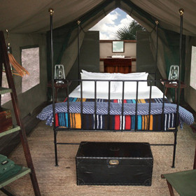 all with open-air, en-suite bathrooms, leading out from the back of the tent.