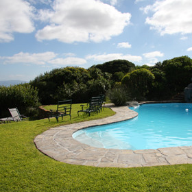 Outside the lodge offers a sparkling blue swimming pool...