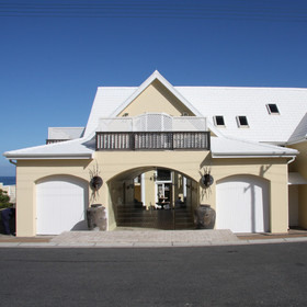 Birkenhead House is perched on the cliffs above a small beach ...