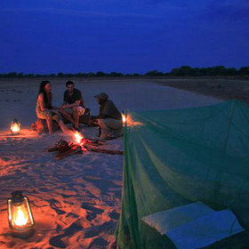 Supper is cooked over the open fire, before an exciting night in the middle of the bush.