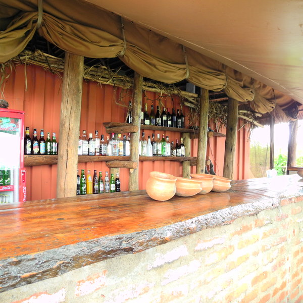 Outside, there is a large wooden bar made from local eucalyptus wood...